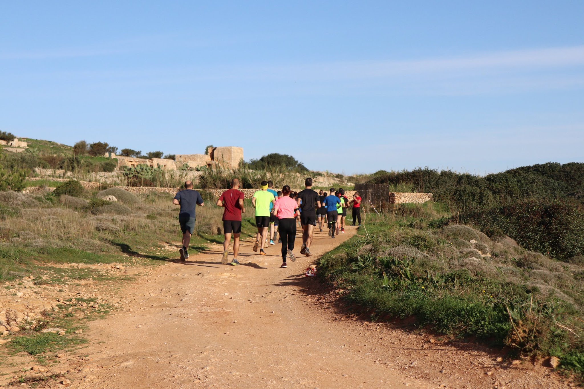 Backyard Ultra runners on a trail in the countryside